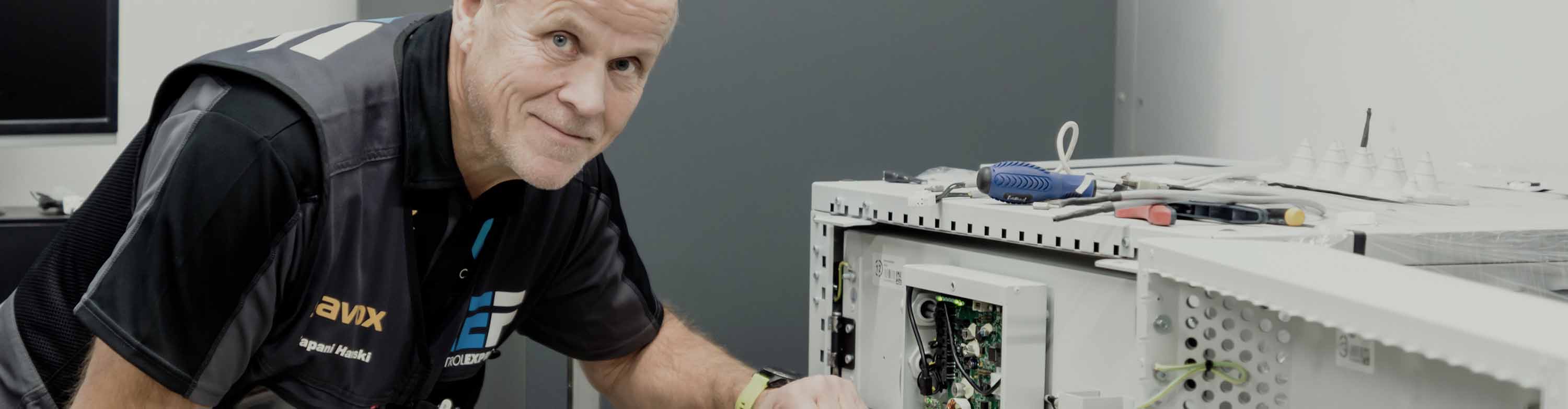 Man standing infront of CEF MoveIT IT equipment cabinet